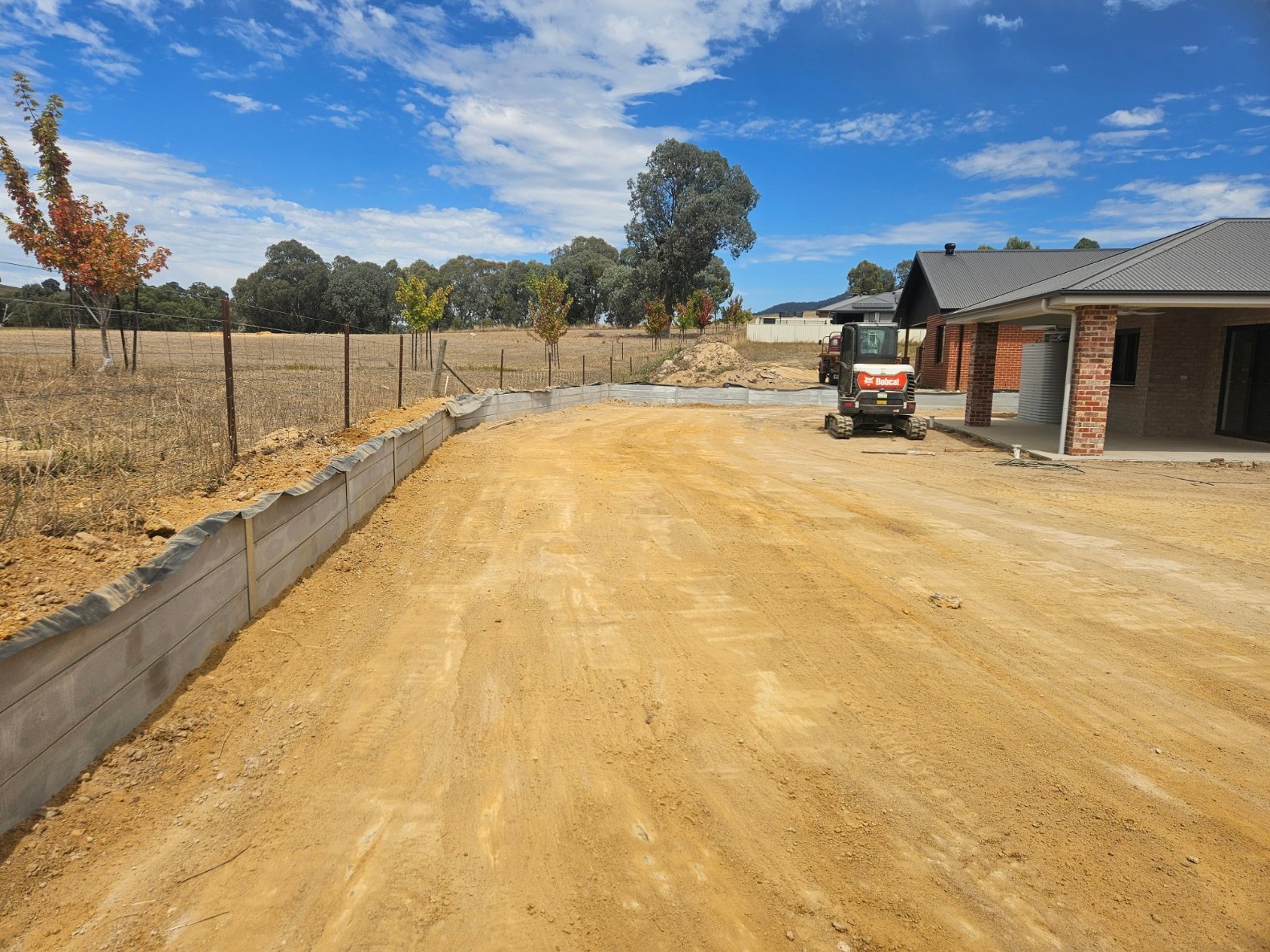 Concrete sleeper retaining wall project photographed by A1 Retaining