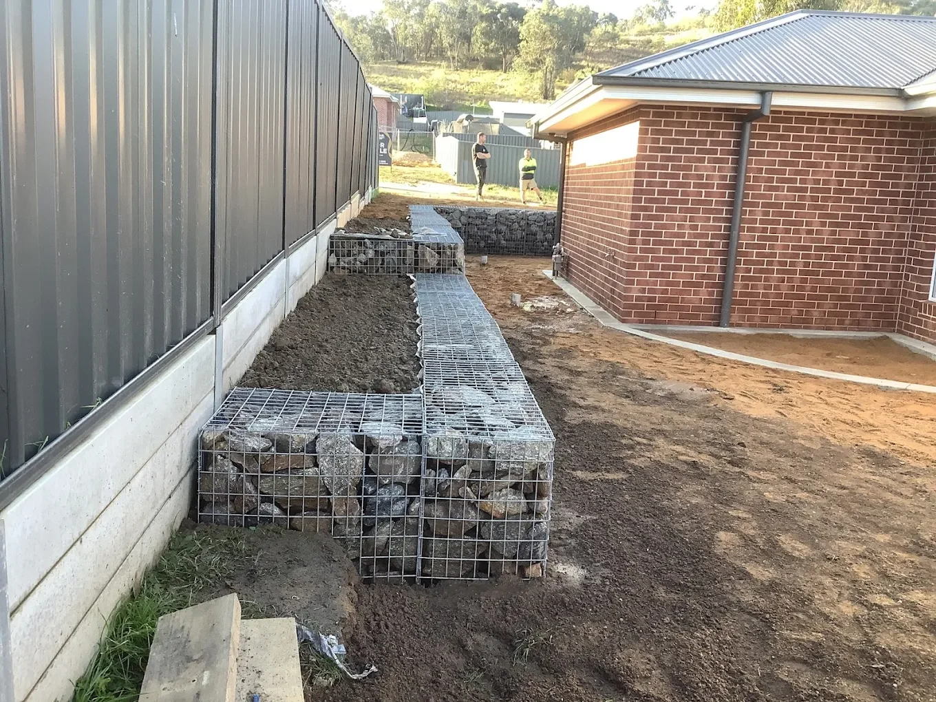Rock-filled gabion retaining wall