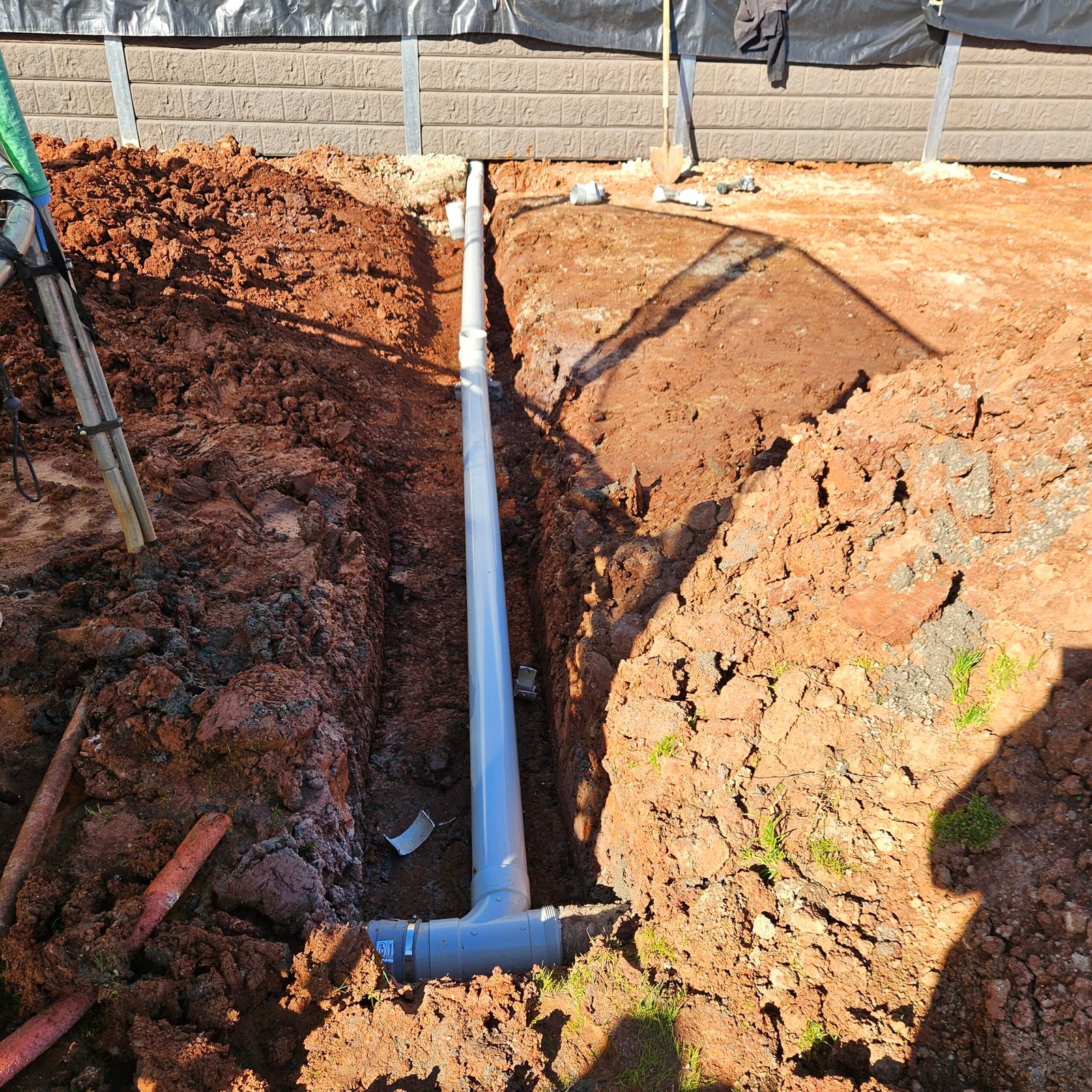 A1 retaining wall construction showing posts and sleepers