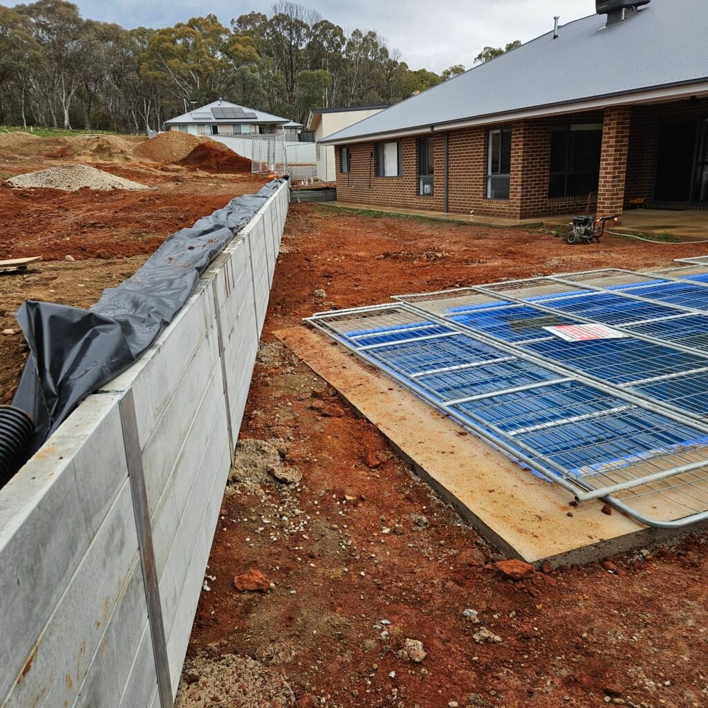 Outdoor site finish and retaining wall preparation