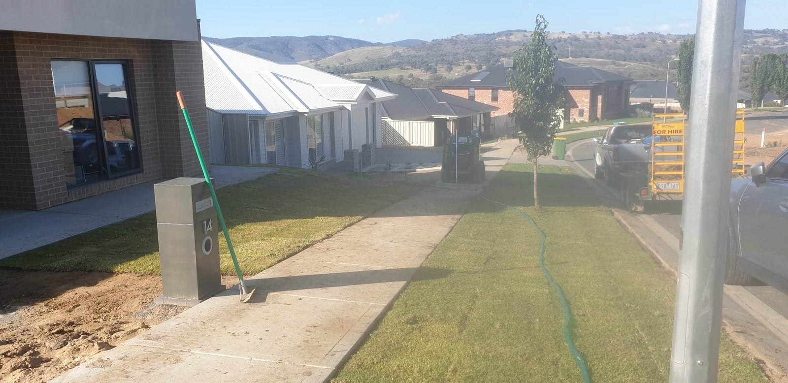 New grass and completed lawn area after ground preparation