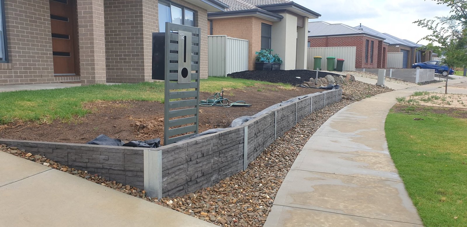 Ground levels around a retaining wall construction area