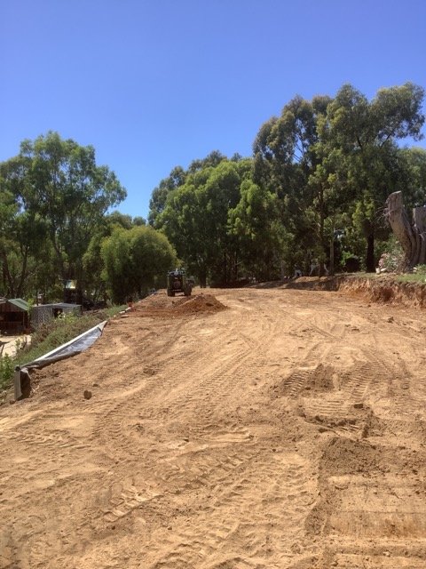 Residential earthworks and ground preparation on a sloping site