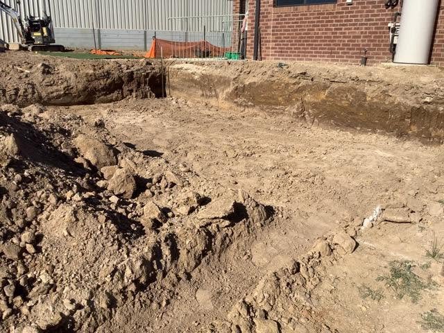 Mini excavator working on a residential A1 project