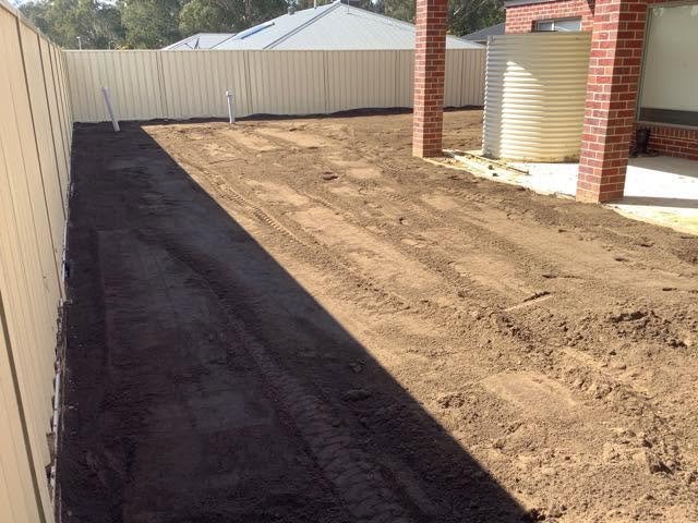 Prepared residential backyard before lawn installation